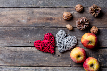 apples, heart shaped toys, fir-cones and nuts