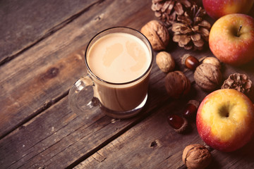 apples, fir-cones, cup of coffee and nuts