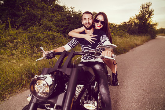 Romantic picture with a couple of beautiful young bikers