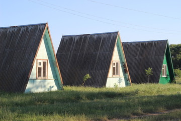 Several small triangle houses near sea