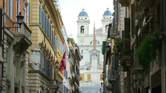 Rome, summer 2016. The church of Trinita dei Monti at the Spanish Steps (Piazza di Spagna). View from Via dei Condotti, main shopping street in Rome.