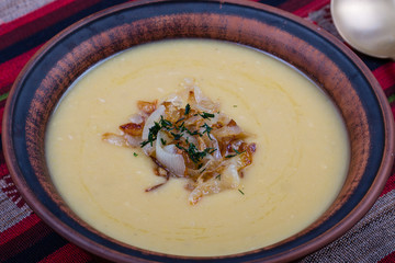 Pea puree with fried onions in a plate