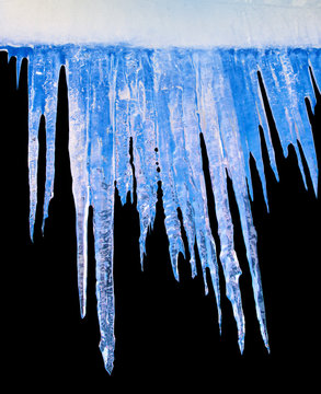 Icicles on an black background. isolated object.