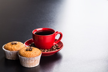 Black coffee, still life with cup and coffee beans.