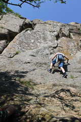 Boy climbing on the rock