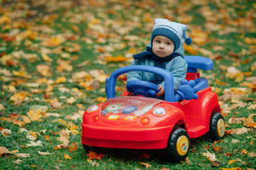 little funny boy driving toy car