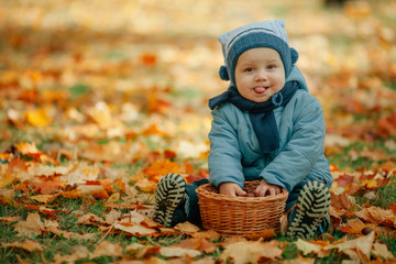little boy in autumn park