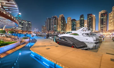 Foto op Canvas Dubai Marina Wandeling in een magische blauwe nacht © MohammedTareq