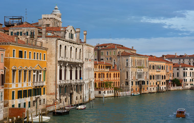 Fototapeta na wymiar Gondolas and boats in the Grand Canal, Venice