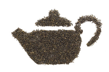 Teapot shape made of organic Green Tea (Camellia sinensis) dried long leaves. Isolated on white background. Top view.