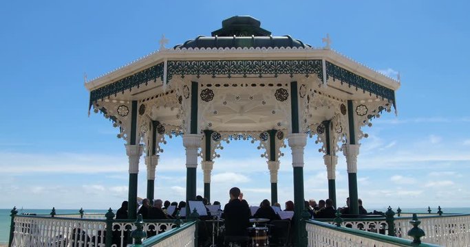 View of orchestra playing music on the victorian bandstand in Brighton and Hove