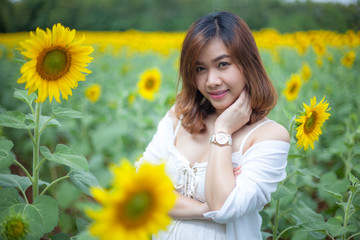 Young asian woman in sunflower field