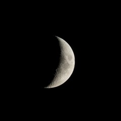 Waxing crescent moon seen with an astronomical telescope