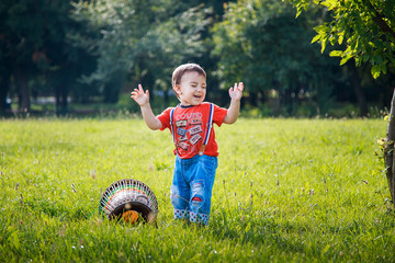 little boy playing with a drum