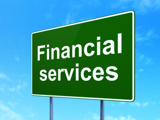 Currency concept: Financial Services on road sign background