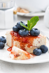 cheesecake with berry jam, vertical closeup