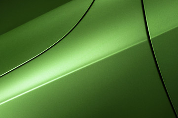 Surface of green sport sedan car, detail of metal hood, fender and door of vehicle bodywork  - obrazy, fototapety, plakaty