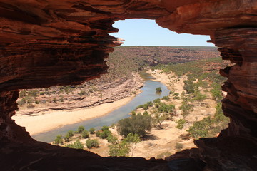 Karijini National Park in west Australia. Beautiful view on canyon with river through the natural window in rock. - obrazy, fototapety, plakaty