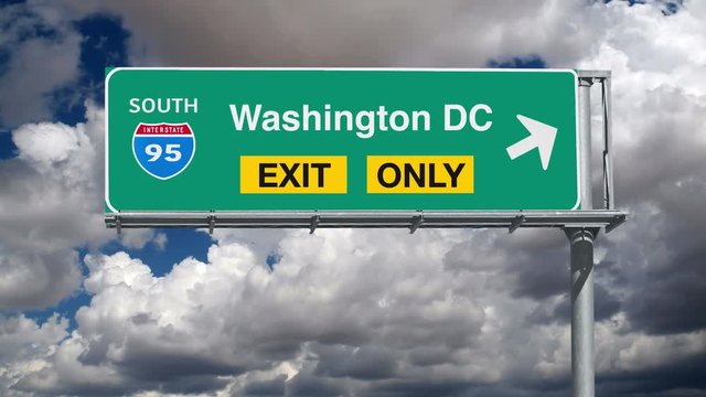 Washington DC Interstate 95 exit only sign with time lapse clouds.