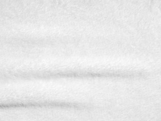 Creased white cloth material fragment as a background texture