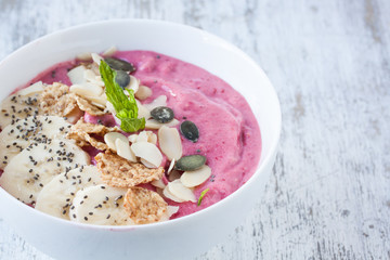 strawberry and raspberry smoothie bowl with banana,almond,cereal