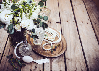 Vintage wedding decor, perfume and pearl beads, flower bouquet