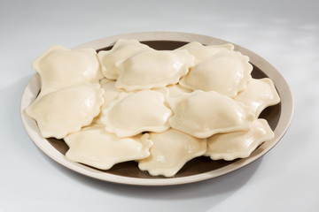 Boiled prepared homemade russian dumplings or pelmeni with beef meat