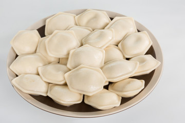 Boiled prepared homemade russian dumplings or pelmeni with beef meat