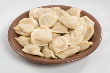 Boiled prepared homemade russian dumplings or pelmeni with beef meat