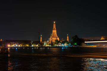 Temple of dawn or Wat Arun with speed of boat