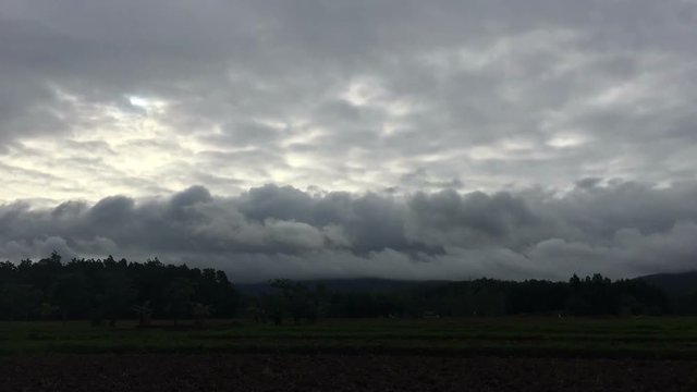 time lapse line smooth dark clouds in the sky before raining, silhouette 