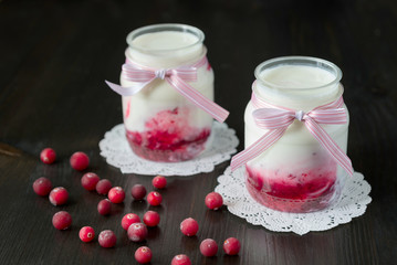 natural yogurt with cranberry jam in a jar