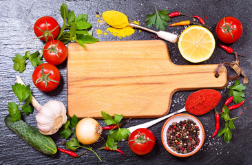 food ingredients for cooking with empty board