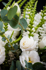 Elegant white bouquet of flowers and leaves macro closeup