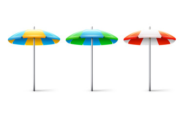 Obraz premium Set of different striped beach umbrellas isolated on white backg