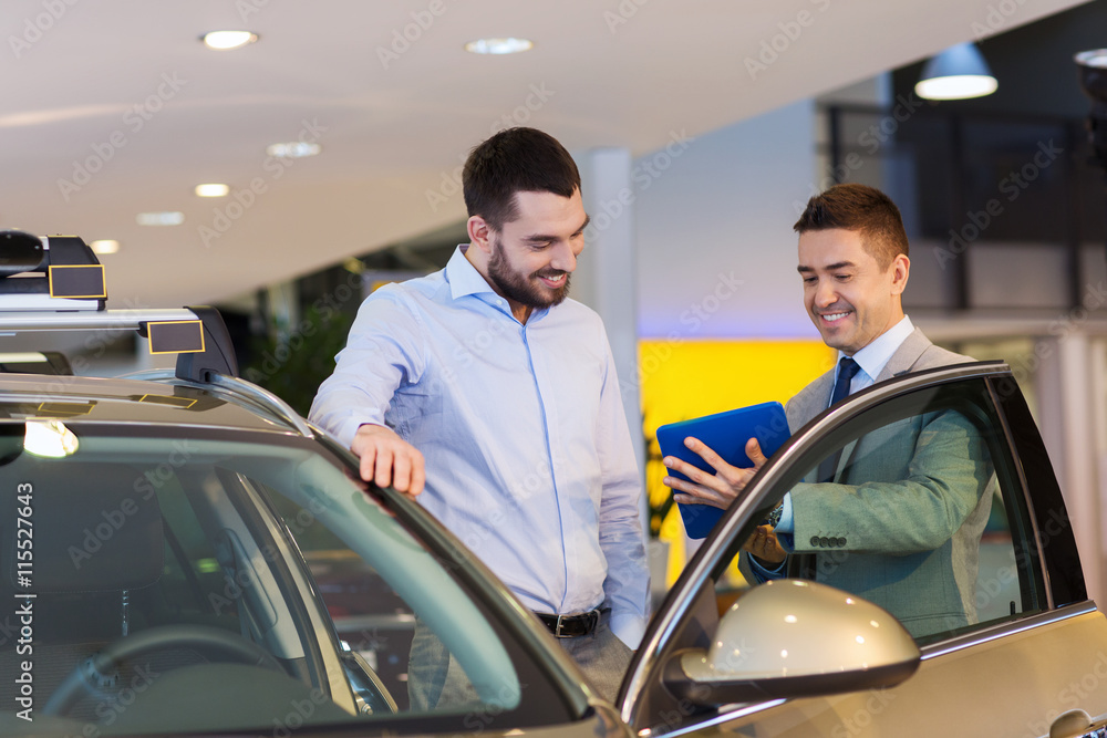 Wall mural happy man with car dealer in auto show or salon