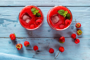 smoothie of strawberries and raspberries on old boards