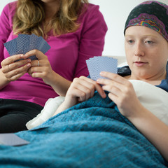 Playing cards with friend with cancer
