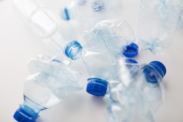 close up of empty used plastic bottles on table