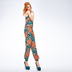 Fashion woman in Summer Outfit, Glamor heels with Pinup hairstyle, Trendy fashion Makeup. Beauty sexy redhead Model, Stylish Fashion Summer look. Pinup model fashion girl, long legs. Unusual creative