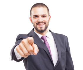 Happy smiling business man pointing the finger at you, isolated