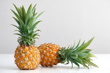 Fototapeta premium Ripe pineapple on a white table