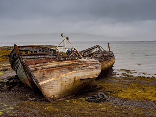 The old wooden boats at Salen Pier, Isle of Mull, Scotland, UK