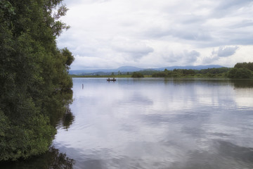 Peaceful fishing scene on Lake of Menteith