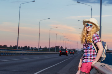 teen girl on road at sunset