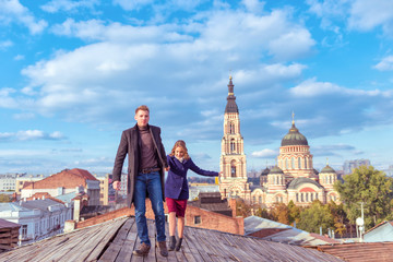 Couple walking on wooden roof