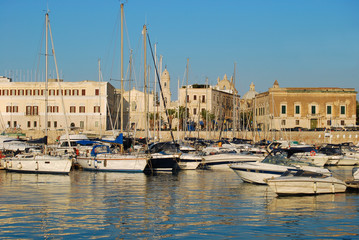 The dock and the city of Trani at sunset in Apulia - Italy