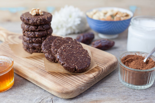 Raw Vegan Paleo Style Cookies, Made With Nuts, Coconut Oil, Honey And Dates, Selective Focus On The Nearest Cookie