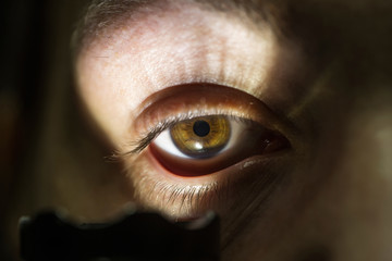 male eye with flashlight