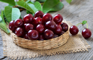 Red cherry in wicker basket